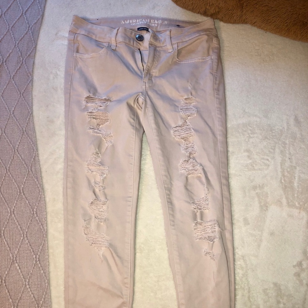 AE light pink ripped jeggings